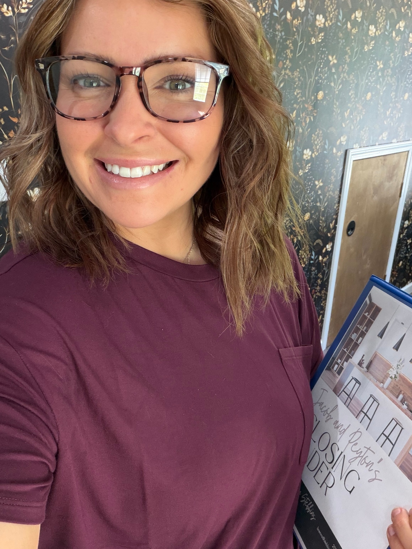 Brenna with a client's closing binder
