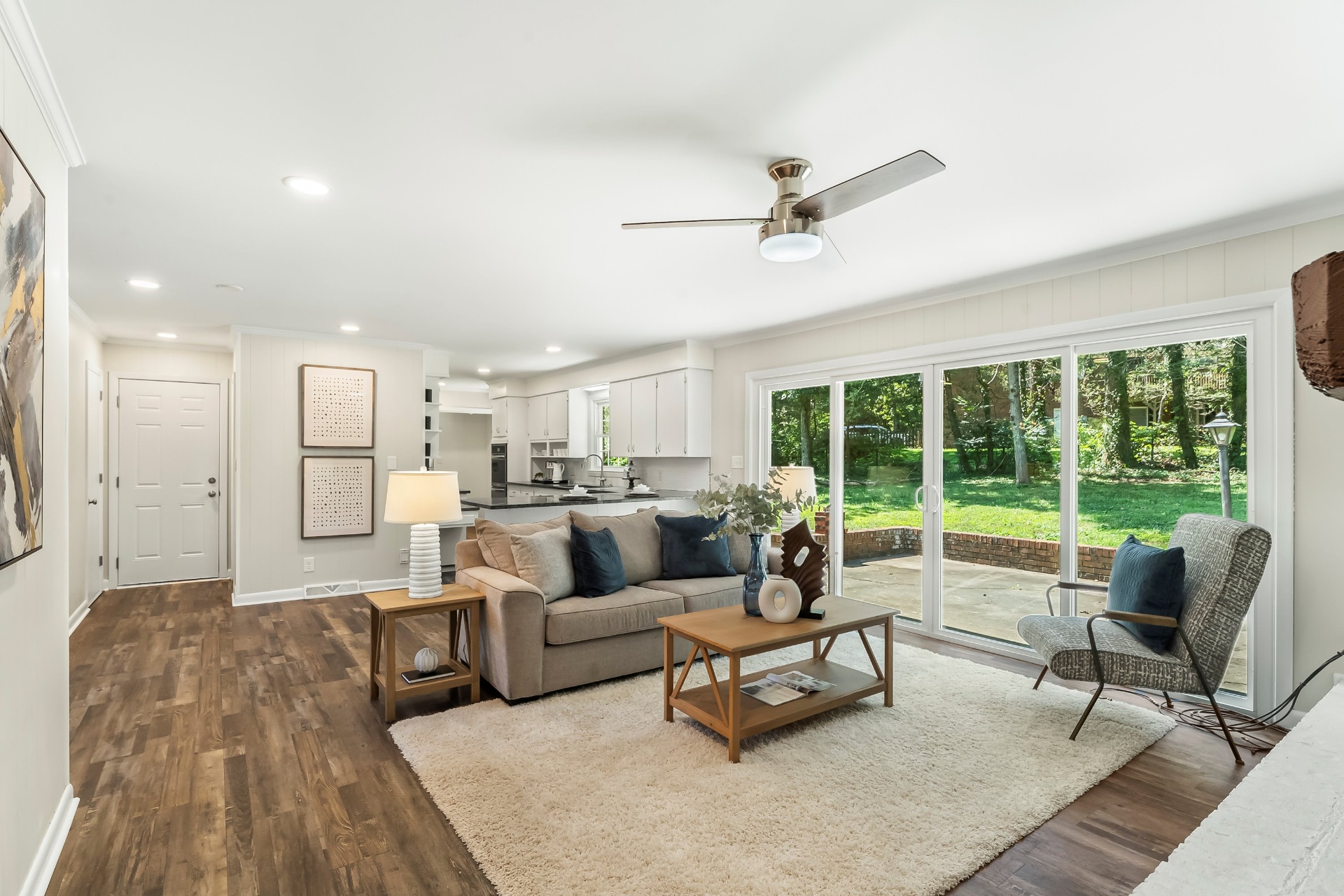 Living room opening to covered patio